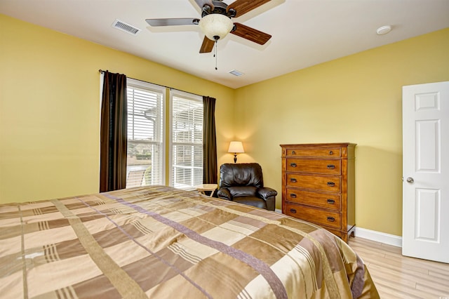 bedroom featuring light hardwood / wood-style floors and ceiling fan