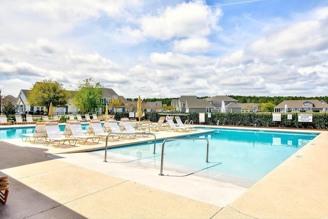 view of swimming pool featuring a patio