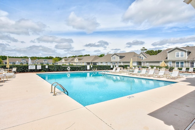 view of swimming pool with a patio area