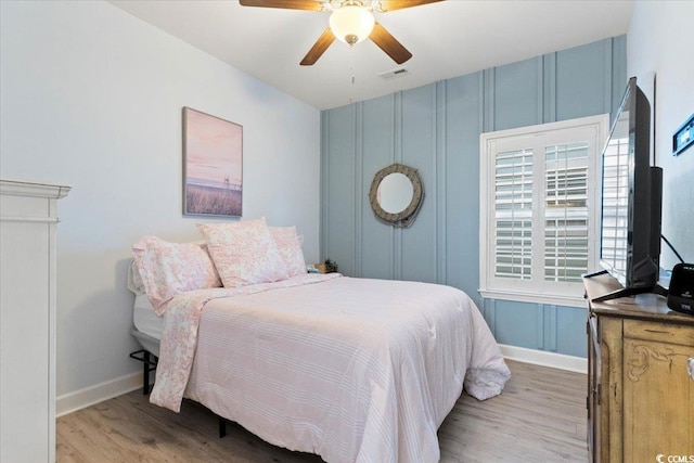 bedroom with ceiling fan and light wood-type flooring