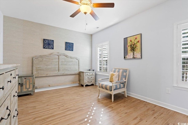 interior space with ceiling fan and light hardwood / wood-style flooring