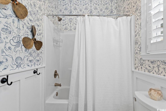 bathroom with toilet and shower / bath combo