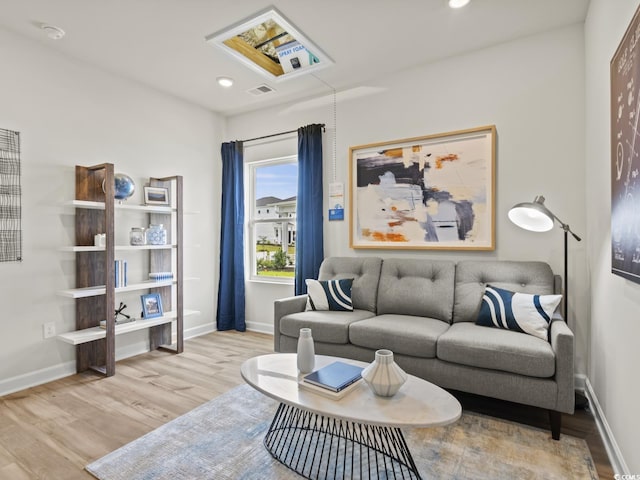 living room with light hardwood / wood-style flooring