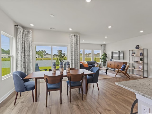 dining room with light hardwood / wood-style flooring