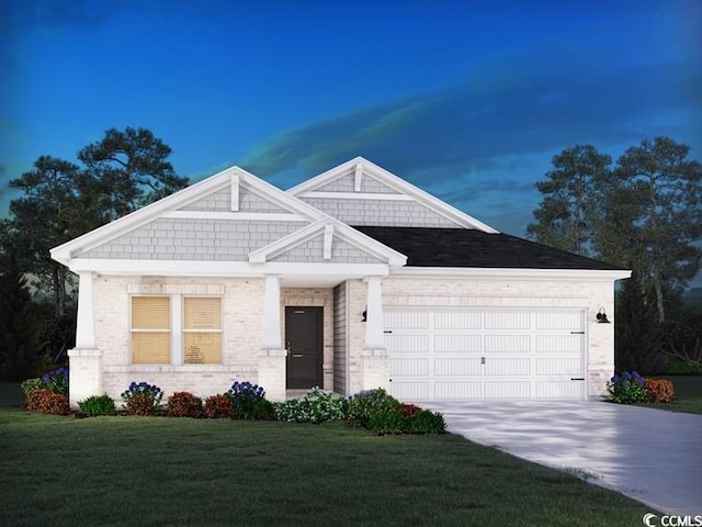 view of front facade featuring a garage and a lawn