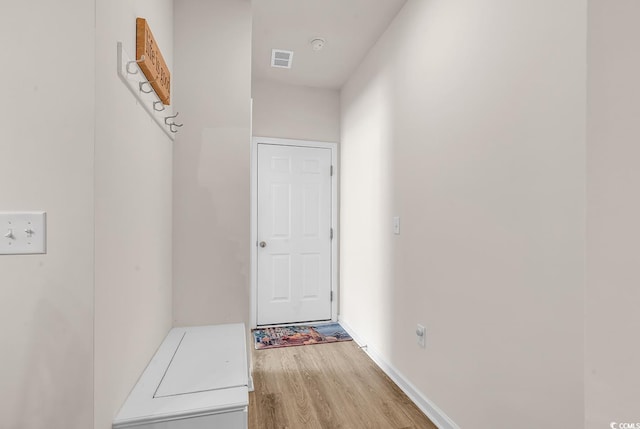 hallway with light wood-type flooring