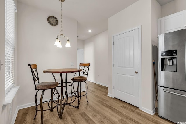 dining area with light hardwood / wood-style flooring