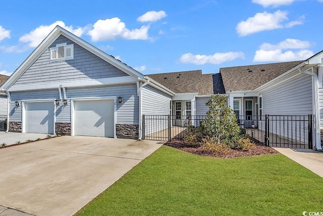 801 San Marco Ct Unit C, Myrtle Beach, SC 29579 - view of front of home with driveway, an attached garage, stone siding, and roof with shingles