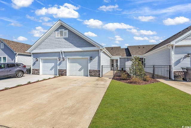 801 San Marco Ct Unit C, Myrtle Beach, SC 29579 - view of front of property with concrete driveway, stone siding, a gate, and an attached garage