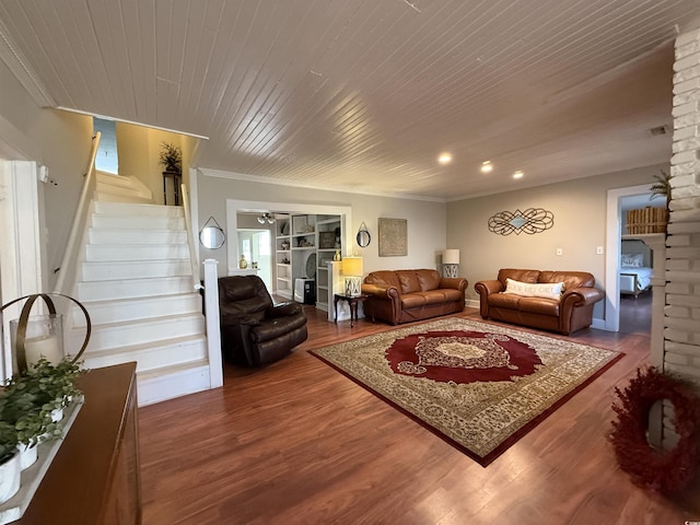 living room with ornamental molding, hardwood / wood-style floors, and wood ceiling