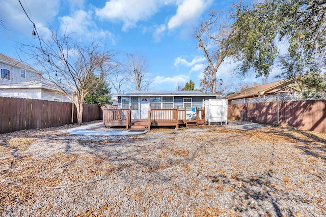 rear view of property with a deck