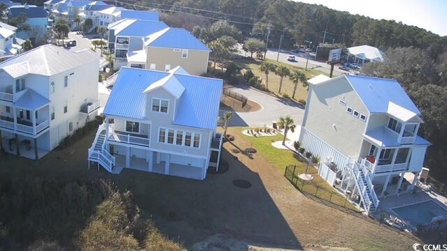 birds eye view of property with a residential view