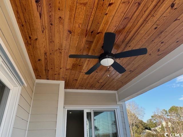 exterior details featuring a ceiling fan