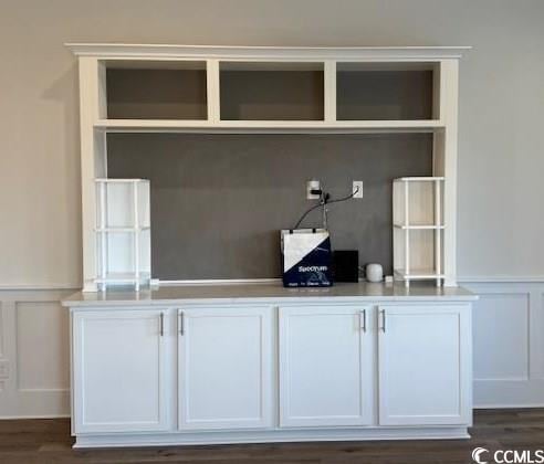 room details featuring white cabinetry and dark wood-type flooring