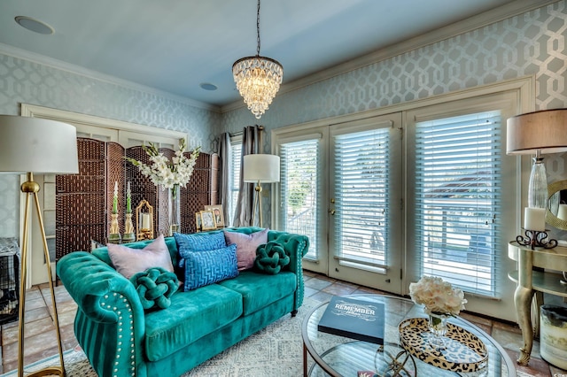 living room with an inviting chandelier, crown molding, and a healthy amount of sunlight