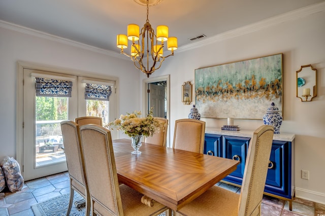 dining area with ornamental molding and a notable chandelier