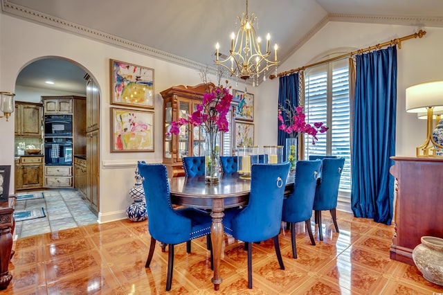 tiled dining room with vaulted ceiling and a notable chandelier