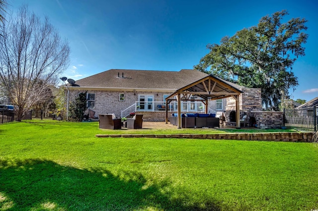 back of house featuring a gazebo, a yard, outdoor lounge area, and a patio area