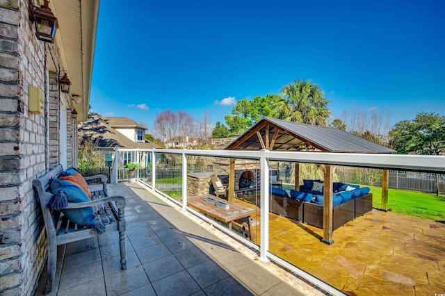 view of patio featuring a balcony and an outdoor hangout area