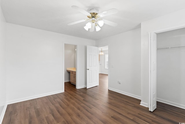 unfurnished bedroom with ceiling fan, dark hardwood / wood-style flooring, and a closet