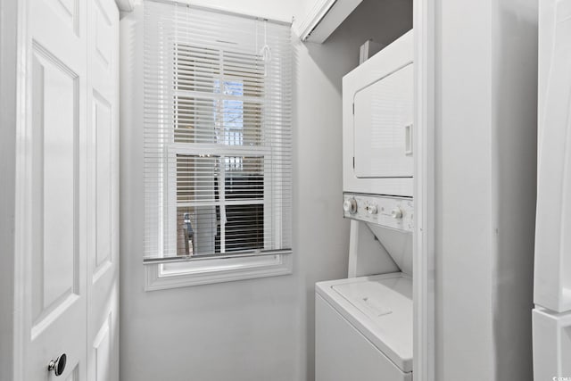 washroom with stacked washer and clothes dryer