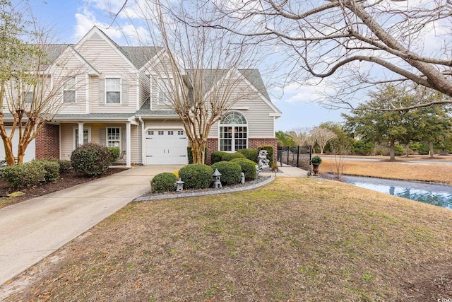 view of front of house with a garage and a front lawn