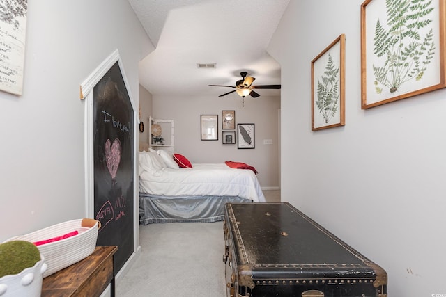 bedroom with carpet floors, ceiling fan, and visible vents