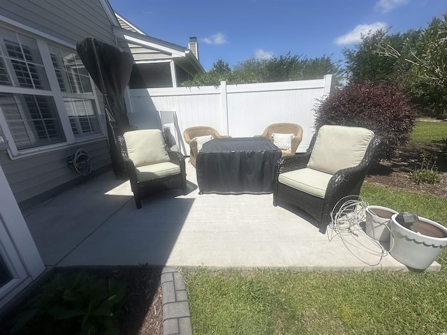 view of patio featuring fence