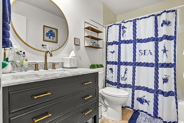 bathroom featuring vanity, tile patterned floors, toilet, and walk in shower