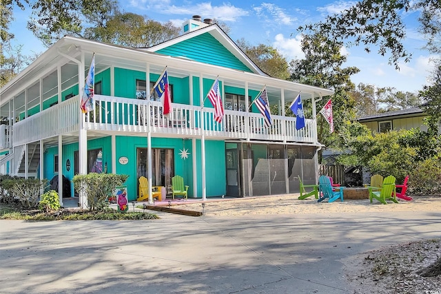 view of front of house with a balcony