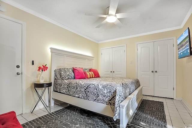 tiled bedroom with multiple closets, ceiling fan, crown molding, and a textured ceiling