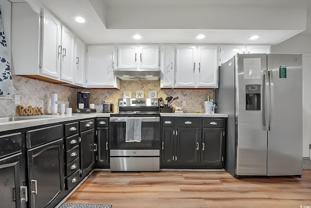 kitchen with white cabinetry, light hardwood / wood-style flooring, stainless steel appliances, and exhaust hood