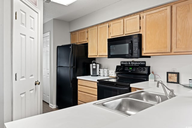 kitchen with sink, black appliances, and light brown cabinets