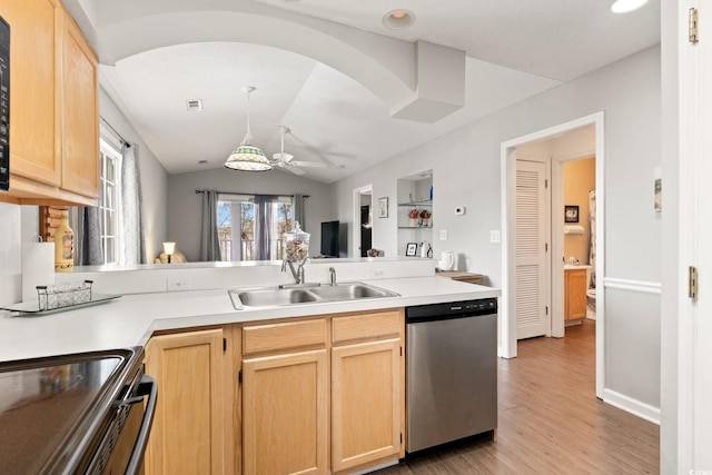 kitchen with dishwasher, sink, light brown cabinets, and light hardwood / wood-style floors