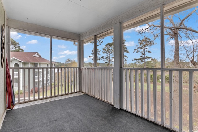 unfurnished sunroom with plenty of natural light