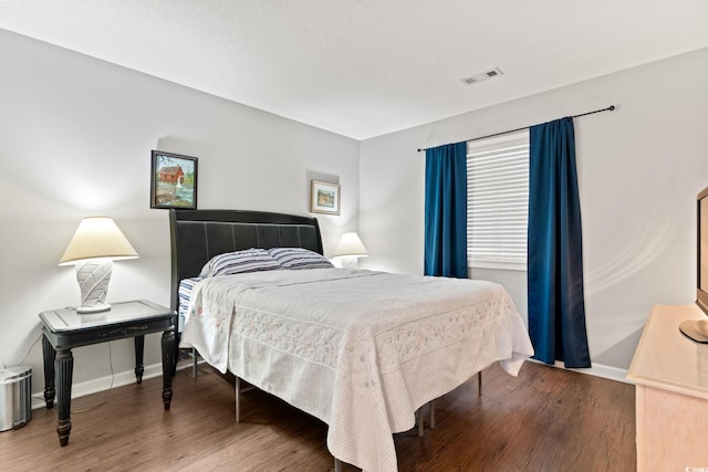 bedroom with wood-type flooring