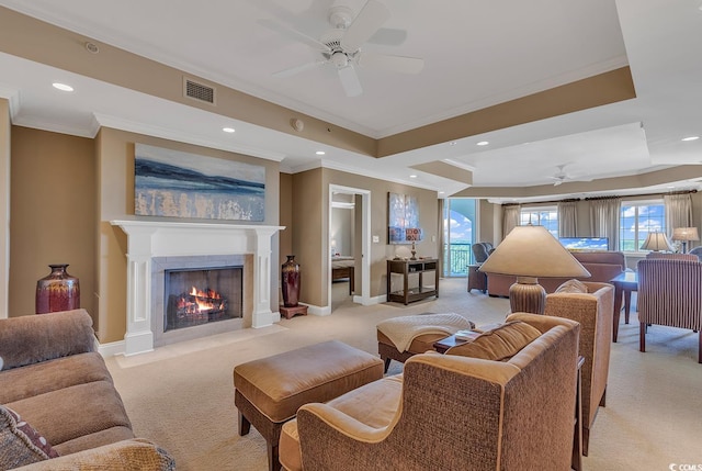 living room featuring crown molding, light colored carpet, ceiling fan, and visible vents