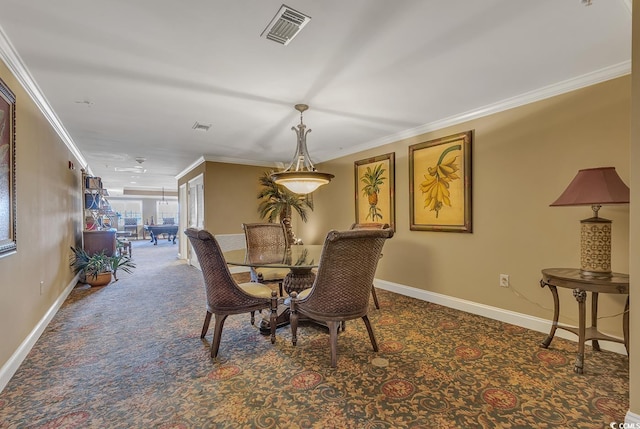 dining space featuring visible vents, crown molding, and carpet floors