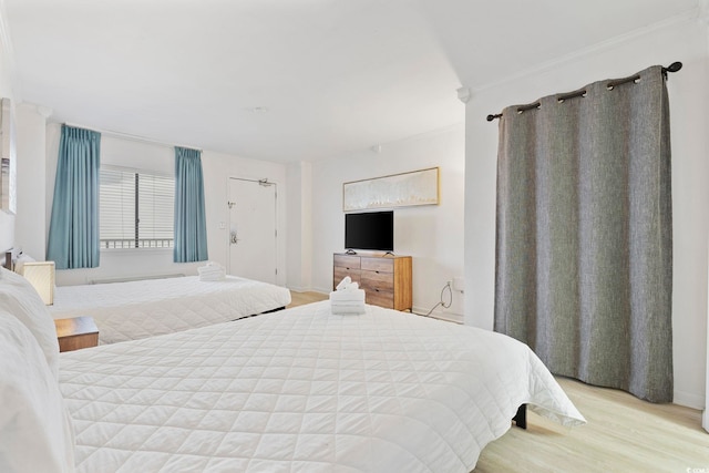 bedroom featuring light wood-type flooring