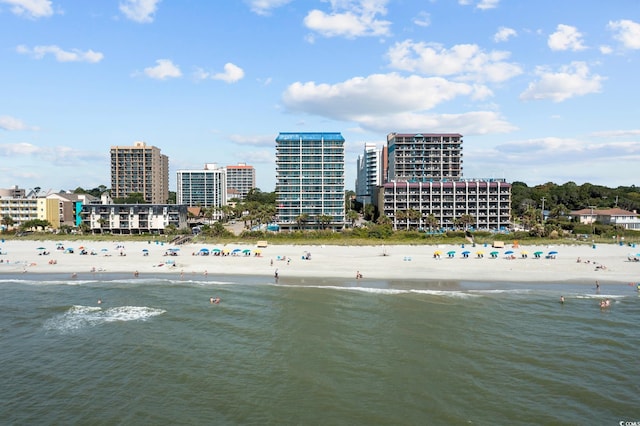 birds eye view of property with a view of the beach and a water view