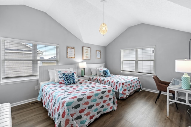 bedroom with lofted ceiling and dark wood-type flooring