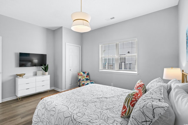 bedroom featuring dark wood-type flooring