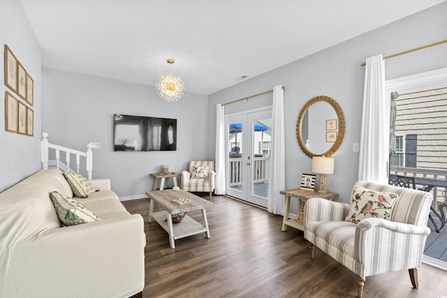 living room featuring dark wood-type flooring and french doors