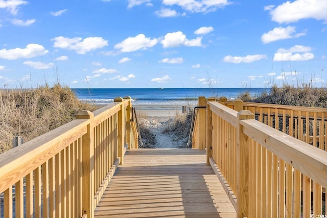 view of property's community with a view of the beach and a water view