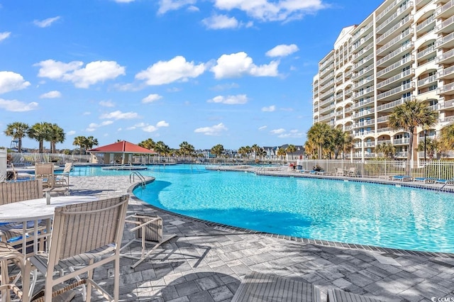 view of swimming pool with a gazebo and a patio area