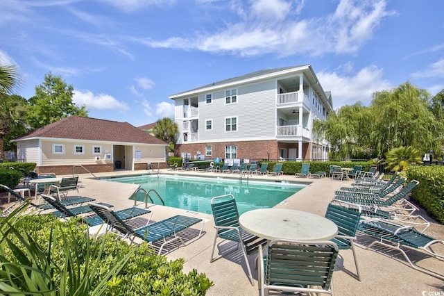 view of swimming pool with a patio area