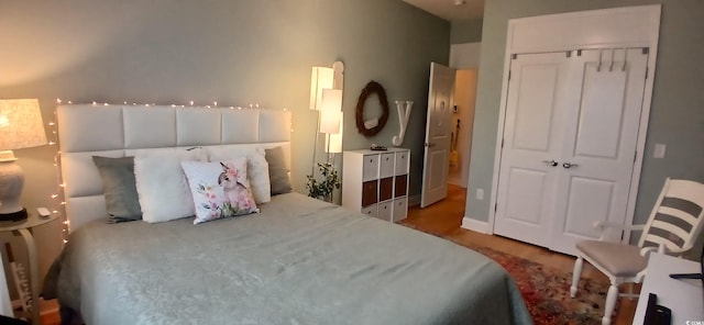 bedroom featuring light hardwood / wood-style flooring and a closet