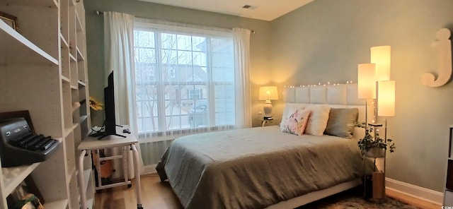 bedroom featuring hardwood / wood-style floors