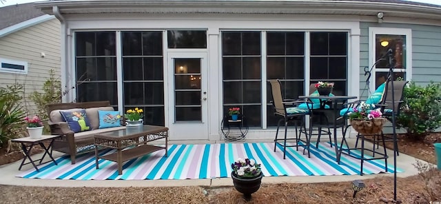 rear view of house featuring an outdoor living space