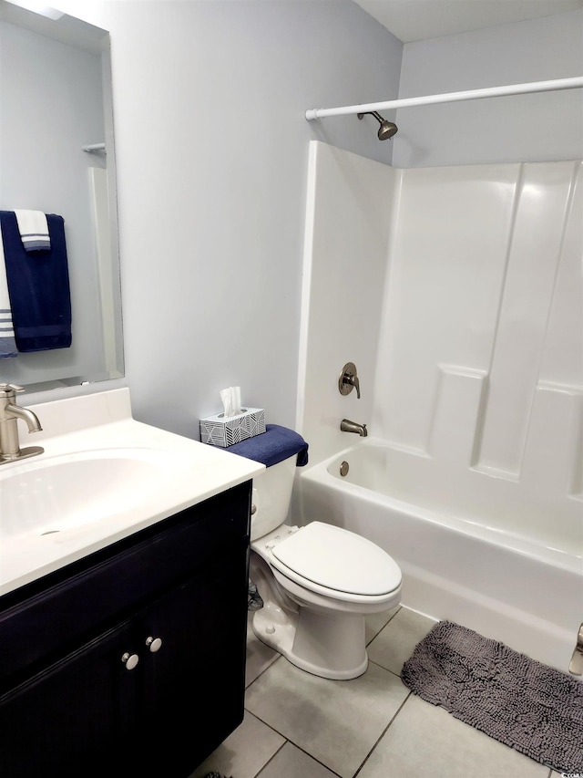 full bathroom with shower / tub combination, tile patterned floors, toilet, and vanity